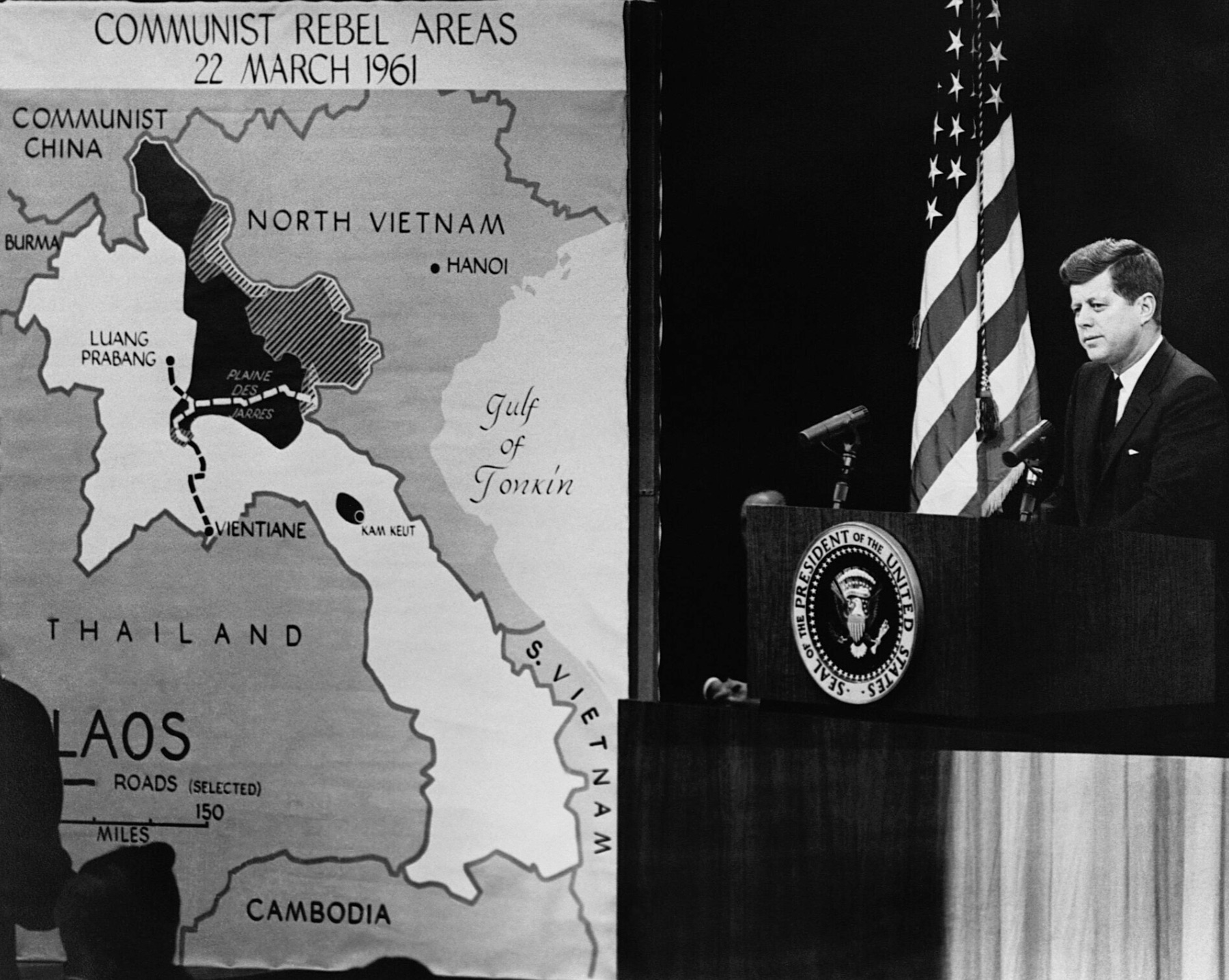 President Kennedy's news conference mapping out Communist strongholds of Vietnam. 